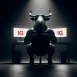 Investors Centre Bull reviewing IG on two computer screens